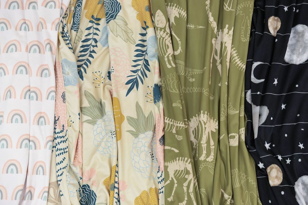 Up close photo of Flowers, Dinosaur, Rainbows, Airplanes and Outer space, and Butterflies Children blankets